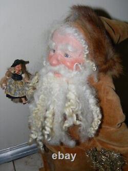 90 One-of-a-kind Santa Figure Running with Doll & Suitcase by LOIS CLARKSON