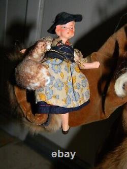 90 One-of-a-kind Santa Figure Running with Doll & Suitcase by LOIS CLARKSON