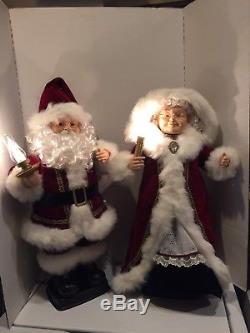 Animated Mr and Mrs Santa Claus with candle lights