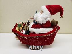 Animated Santa Claus Sitting On Turning Sleigh Sound Activated Music