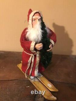 Antique 8 German Santa Claus on Skiis Candy Container