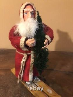 Antique 8 German Santa Claus on Skiis Candy Container