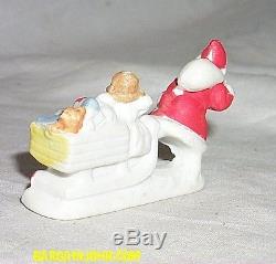 Antique Snow Baby Santa Claus with Sled and Toys