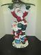 Collectable 2 Santa Claus Christmas Statue Holding A Clear Glass Table Top