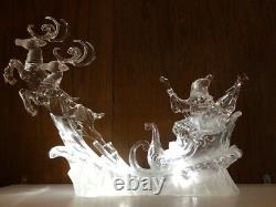 Magnificent figure of Santa Claus in sleigh with light