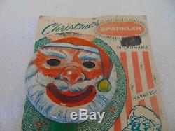 NOS Vintage Christmas Tin Metal Santa Claus Face Mechanical Sparkler Toy on CARD