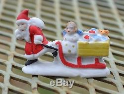 Rare Antique German Snow Baby Santa Claus with Sled and Toys Figurine