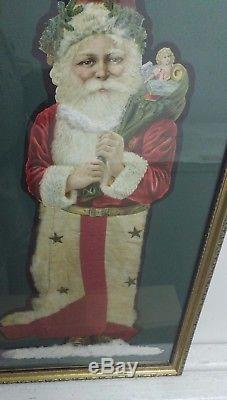 Santa Claus die cut, 20 tall, gorgeous frame. He walks through snow. VG. 1920s
