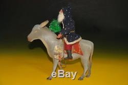 Santa Claus riding on donkey papier-mâché Germany at 1900