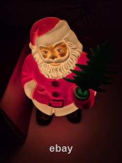This is a vintage light-up Santa Claus blow mold figure. 1953