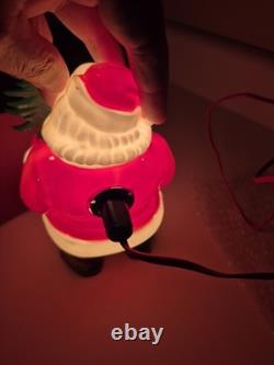 This is a vintage light-up Santa Claus blow mold figure. 1953