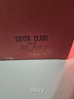 This is a vintage light-up Santa Claus blow mold figure. 1953