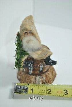 Vintage German Bellsnickle Santa Claus Setting on a Lightweight Log