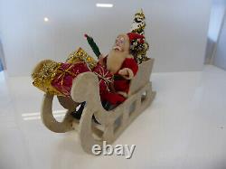 Vintage Santa in Vintage Sleigh with Tree and Xmas Packages