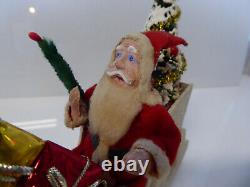 Vintage Santa in Vintage Sleigh with Tree and Xmas Packages