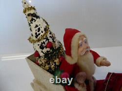 Vintage Santa in Vintage Sleigh with Tree and Xmas Packages