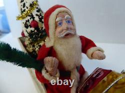 Vintage Santa in Vintage Sleigh with Tree and Xmas Packages