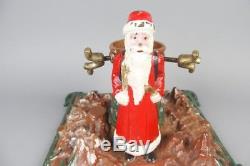 Vintage christmas tree stand with santa claus figure, cast iron