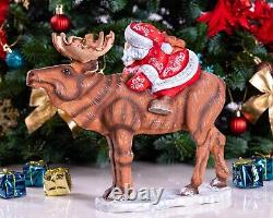 Wooden carved Santa Claus figurine riding a moose, Christmas gift home decor