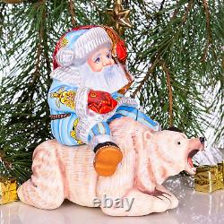 Wooden hand carved Santa Claus figurine riding a bear, Christmas home decor