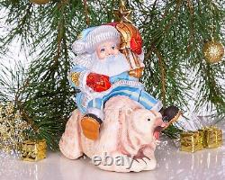 Wooden hand carved Santa Claus figurine riding a bear, Christmas home decor