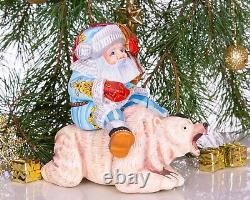 Wooden hand carved Santa Claus figurine riding a bear, Christmas home decor