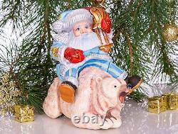 Wooden hand carved Santa Claus figurine riding a bear, Christmas home decor