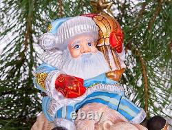 Wooden hand carved Santa Claus figurine riding a bear, Christmas home decor