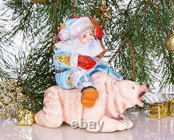 Wooden hand carved Santa Claus figurine riding a bear, Christmas home decor