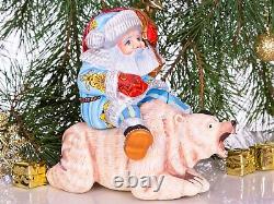 Wooden hand carved Santa Claus figurine riding a bear, Christmas home decor